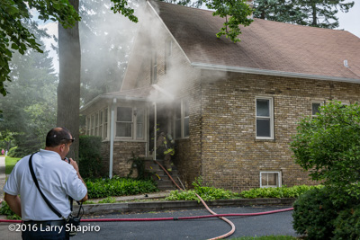 Wilmette house fire 7-30-16 at 1826 Elmwood Avenue in Wilmette IL Larry Shapiro photographer shapirophotography.net firefighters revive cat at fire scene